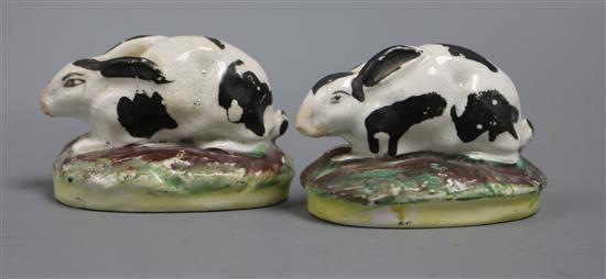 A pair of Staffordshire pottery miniature rabbits height 5cm